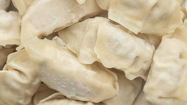 Close up of uncooked frozen dumplings.