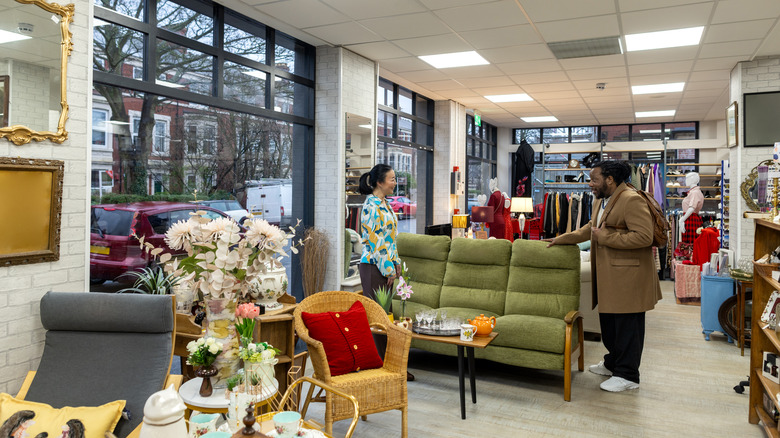 People shopping in a thrift store.