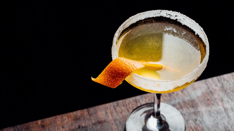 cocktail with a salt rim and an orange peel