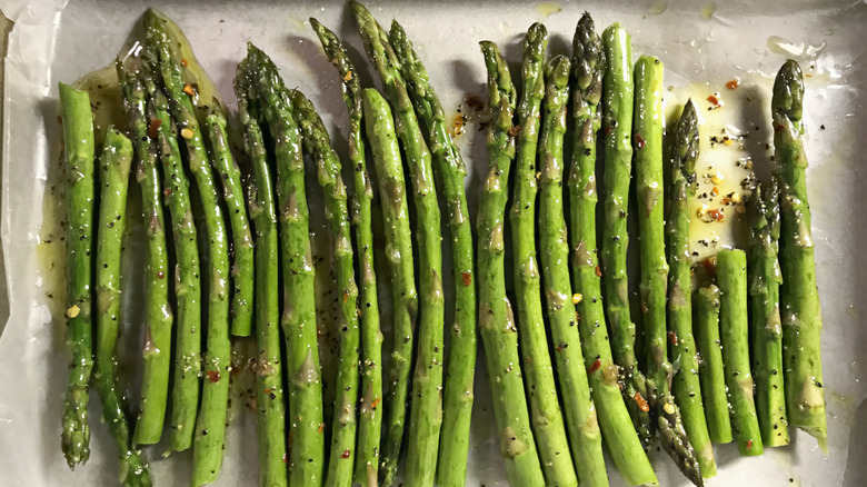 Fresh roasted asparagus on parchment paper