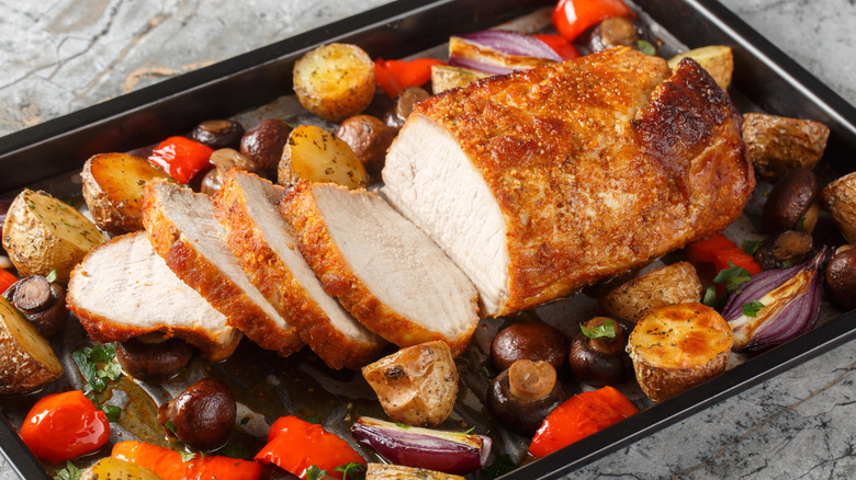 roasted pork tenderloin served with vegetables