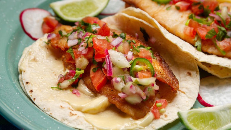 Close up of fish tacos with toppings