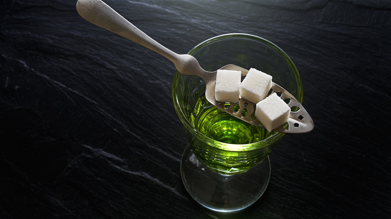 absinthe, spoon, and sugar cubes