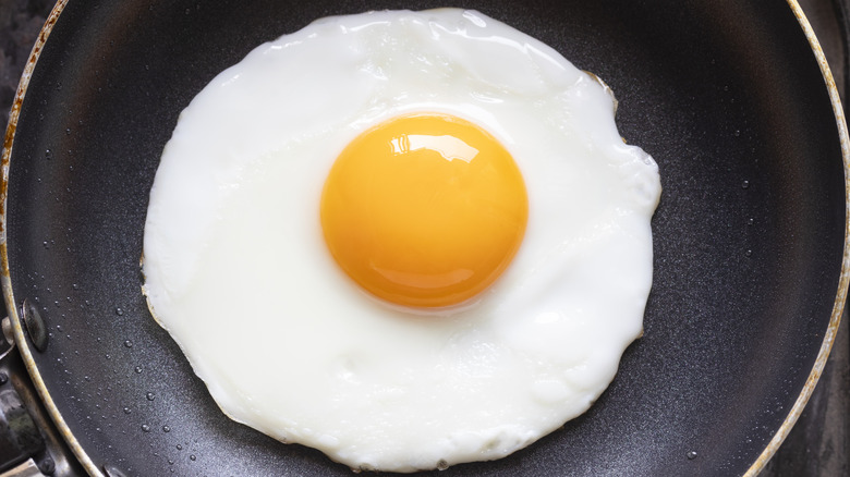 close up of a fried egg in a pan