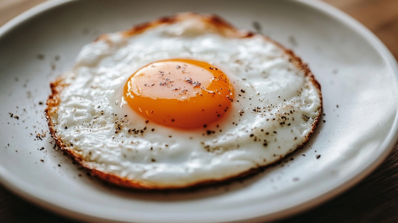 Close up Fried eggs on a white plate