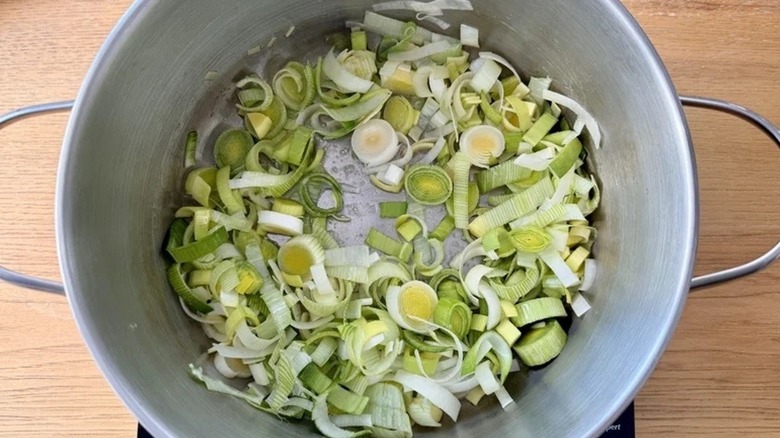 Chopped leeks cooking in a saucepan
