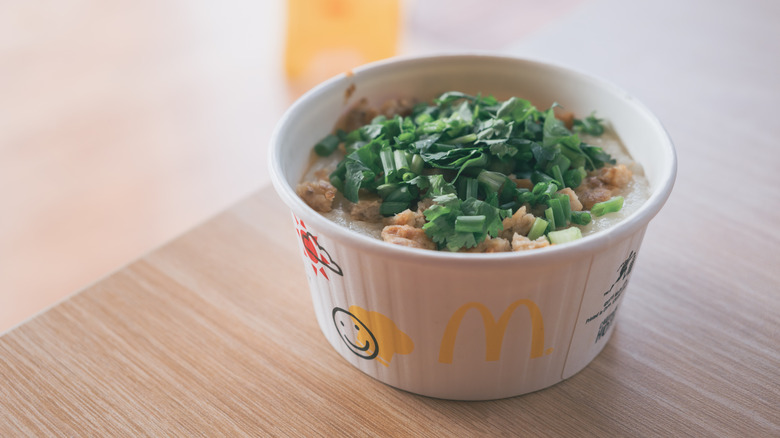 Bowl of McDonald's porridge in Thailand on wood table