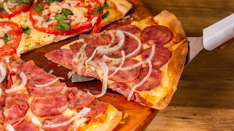 Pizza with pepperoni and onions