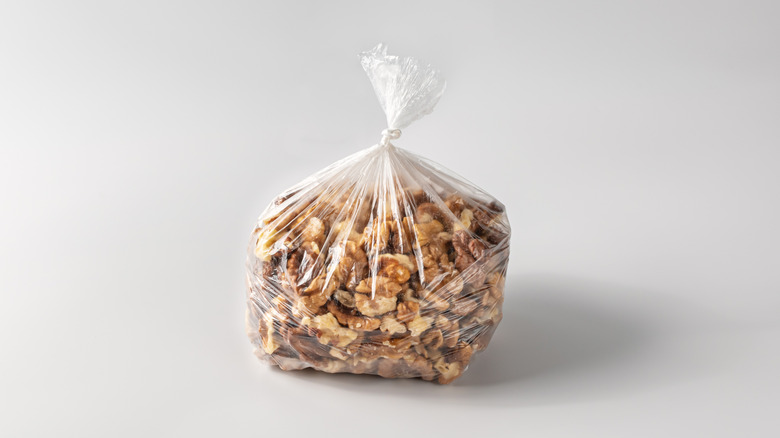 plastic bag of walnuts tied shut