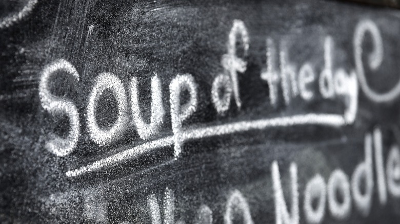 A soup of the day advertisement on a chalkboard