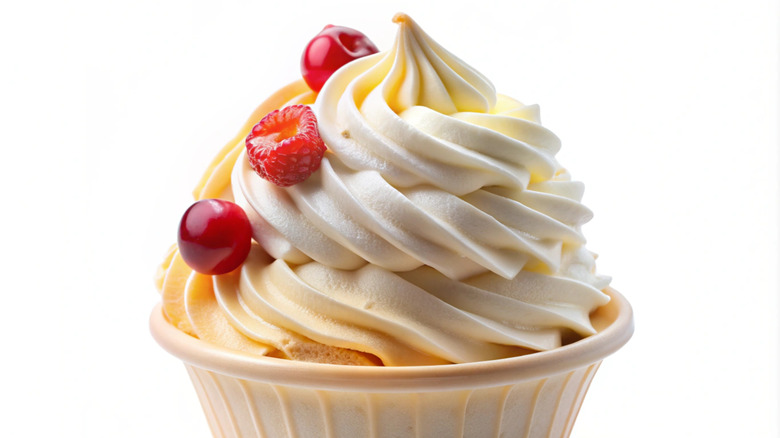 A cup of frozen custard with fresh berry toppings