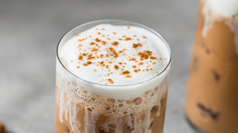 Iced chai latte with pumpkin spice cold foam.