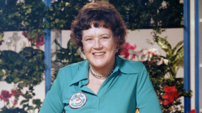 Close up of Julia Child smiling in a green blouse
