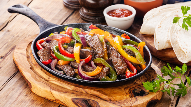 fajitas in cast iron pan