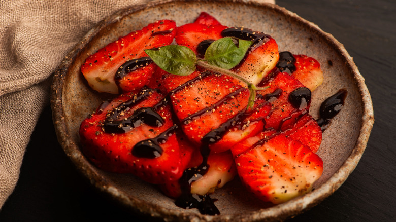 Strawberries with balsamic cream and black pepper.