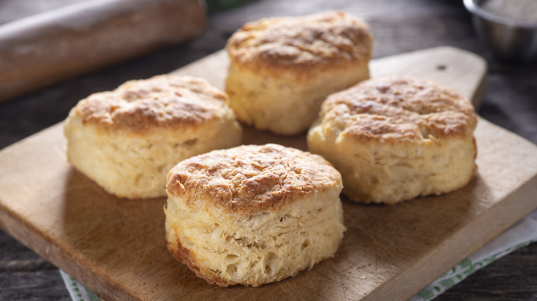 Four biscuits on cutting board