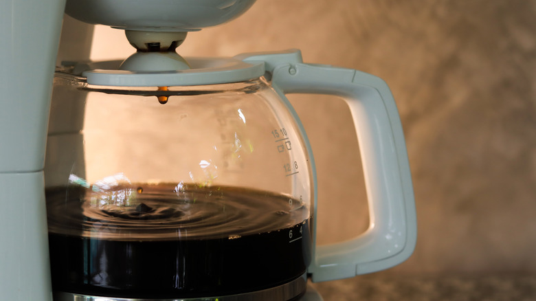 a coffee pot drips coffee
