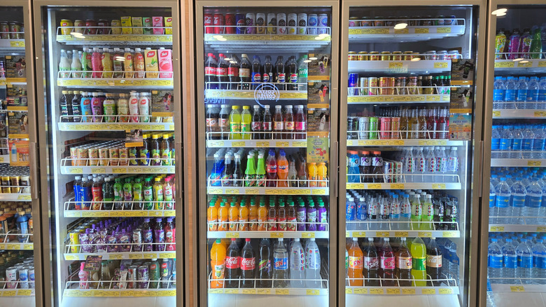 Drinks neatly organized in a store fridge