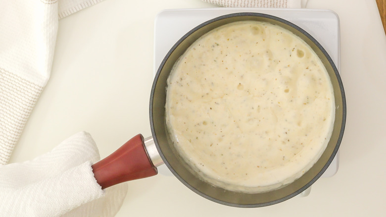 saucepan of alfredo sauce
