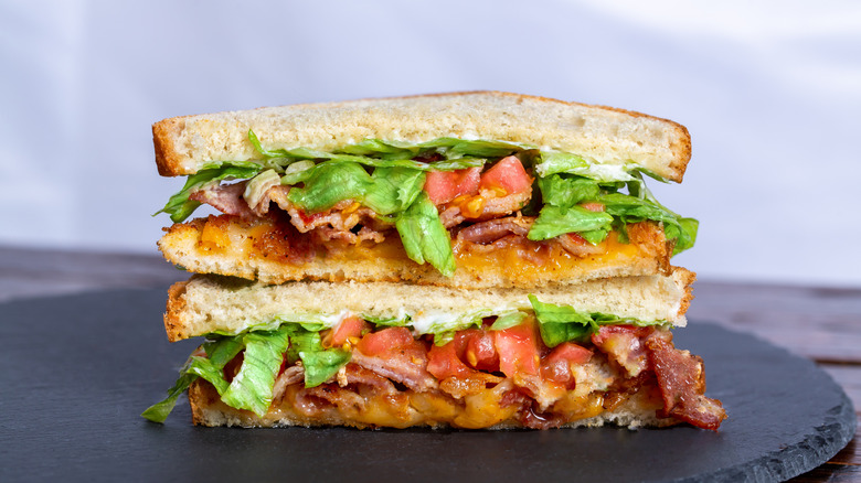BLT sandwich halves stacked on top of one another.
