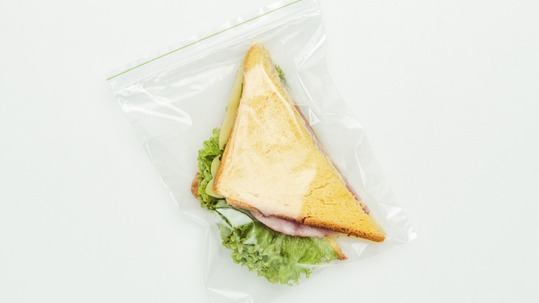 A sandwich in a Ziploc bag on a white background