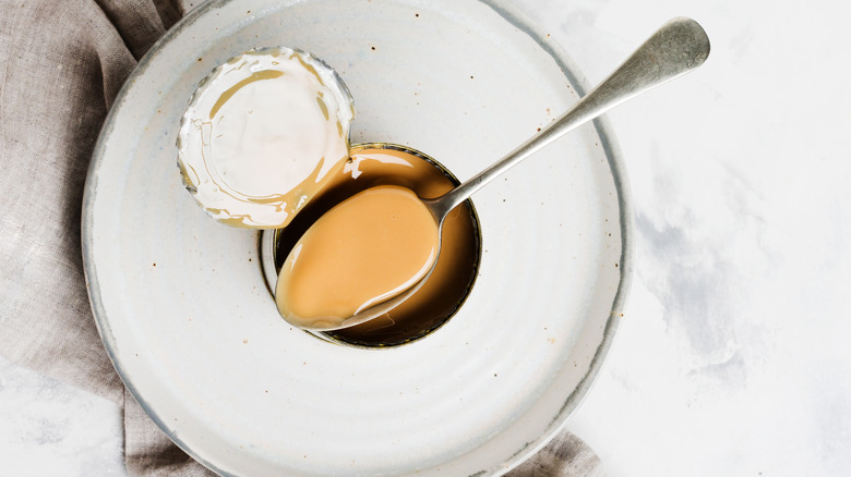 Spoon on a can of evaporated milk