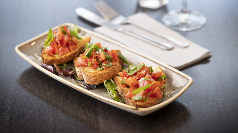 Bruschetta on a small rectangular plate