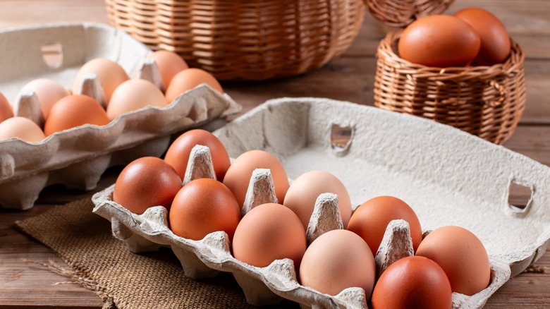 Dozen brown eggs in carton