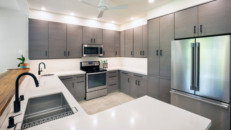 A contemporary renovation remodeled open concept kitchen interior design in a modern home