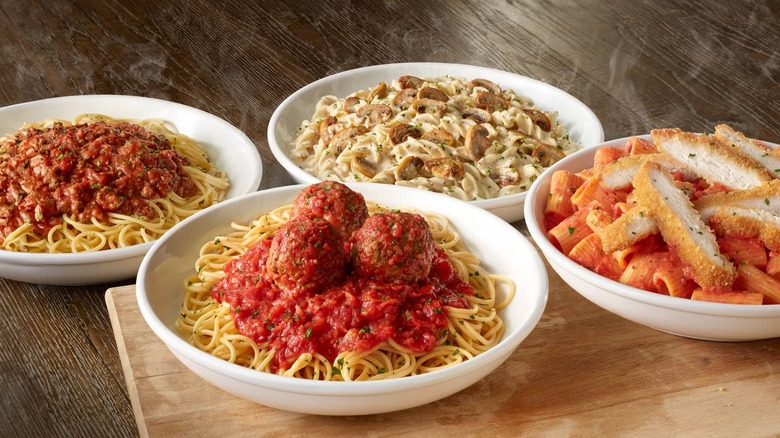 four plates of different pastas from Olive Garden