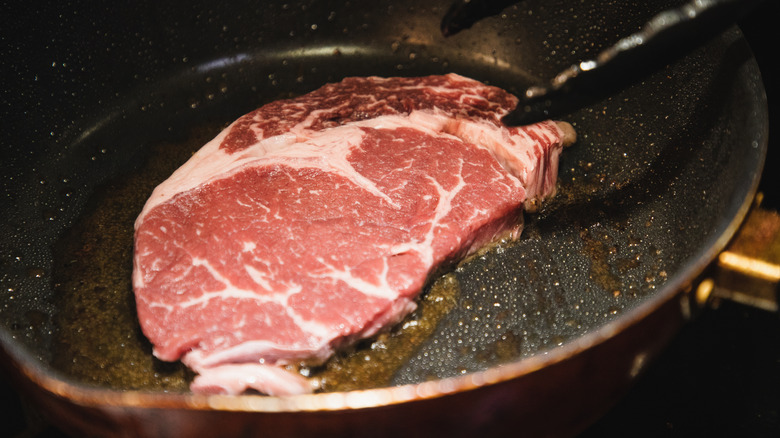 Thin steak cut in half