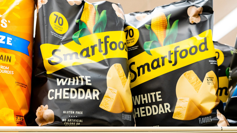 Smartfood white cheddar popcorn on grocery store shelf