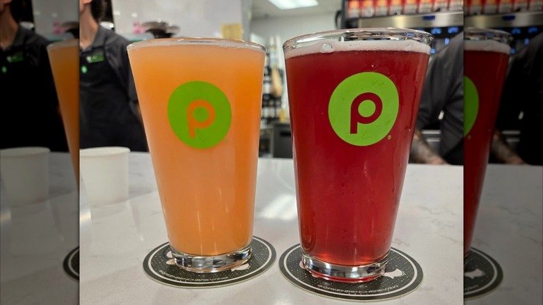 Two colorful beers on coasters at a Publix Pours