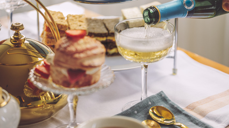 Champagne and desserts on a table with a tablecloth