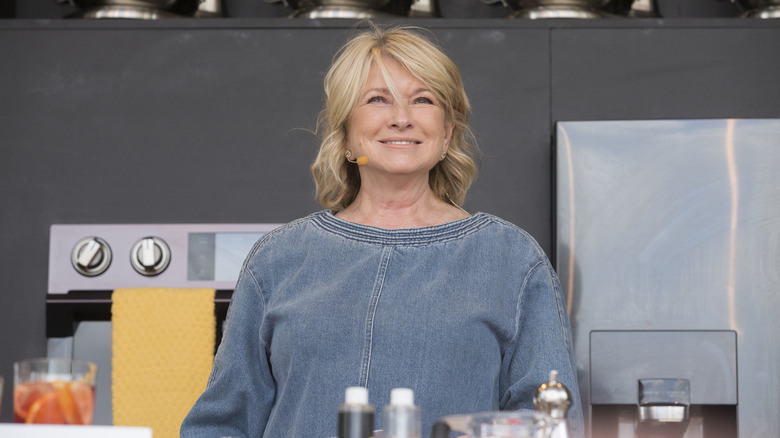 Martha Stewart is pictured on stage at a live cooking demonstration.
