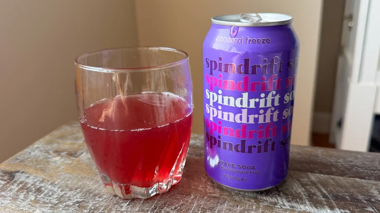 Concord Freeze soda on a table with a glass