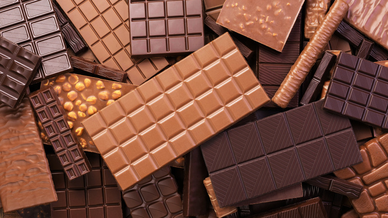 A pile of various chocolate bars