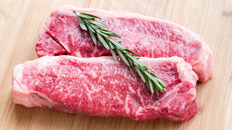 New York strips with thyme