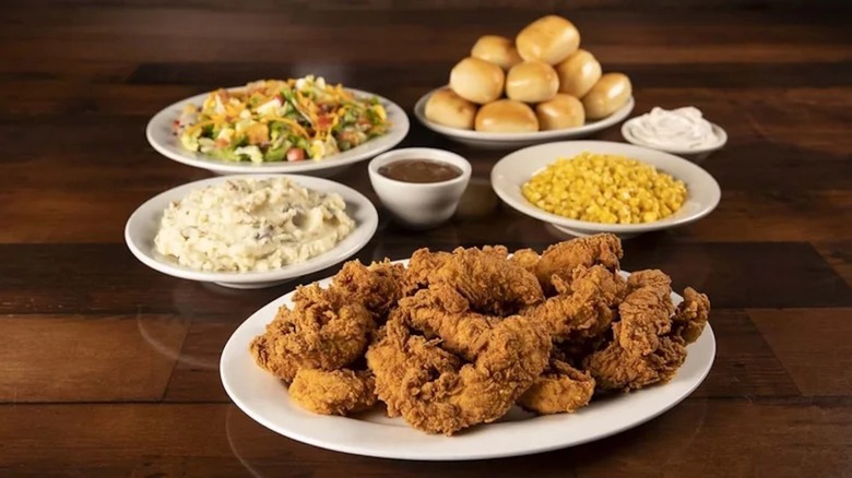 Texas Roadhouse's Chicken Critters Family Meal with mashed potatoes, corn, salad, and dinner rolls