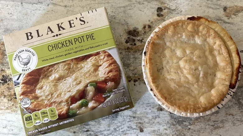 Box of Blake's chicken pot pie next to the pie in its dish.