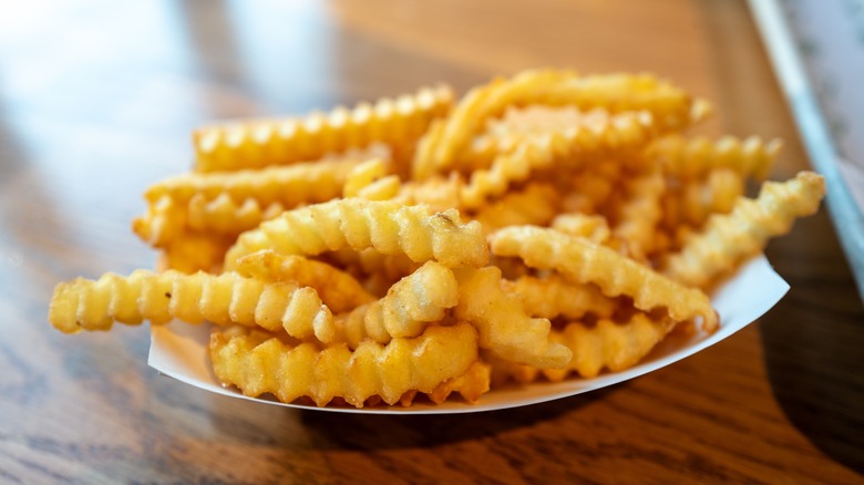 Crinkle French fries on a plate