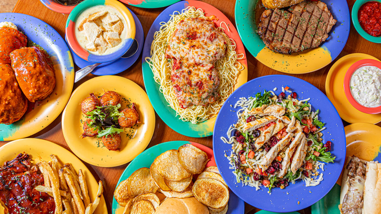 Various restaurant foods in colorful bowls