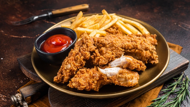 chicken tenders, ketchup, and fries