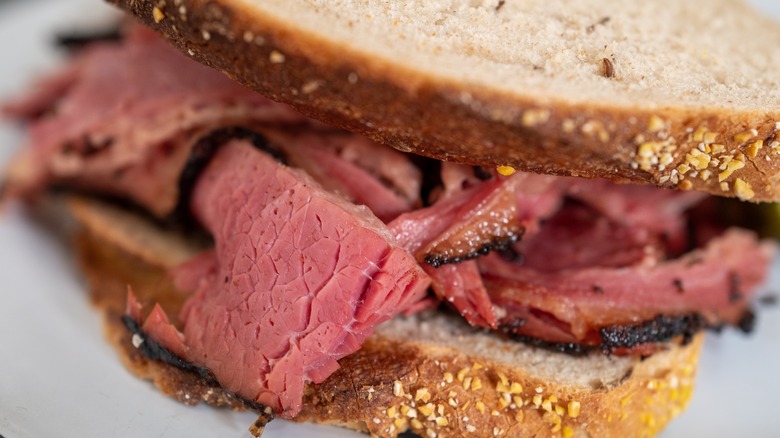 Close up of a pastrami sandwich