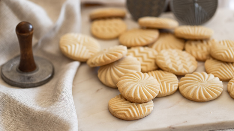 Fresh butter cookies stamped with a variety of shapes