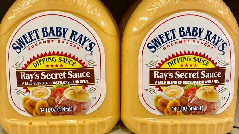 Two bottles of Sweet Baby Ray's Secret Sauce