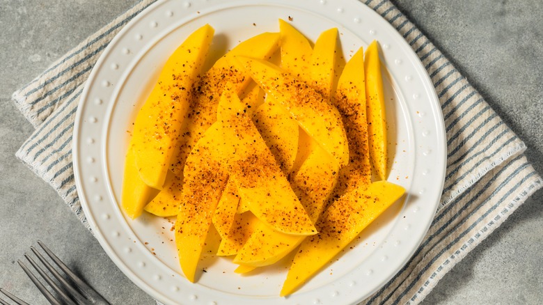 Mango slices topped with Tajín