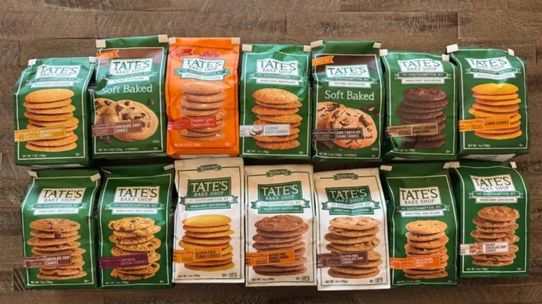 An array of Tate's Bake Shop cookie packages in different flavors laid out across two rows