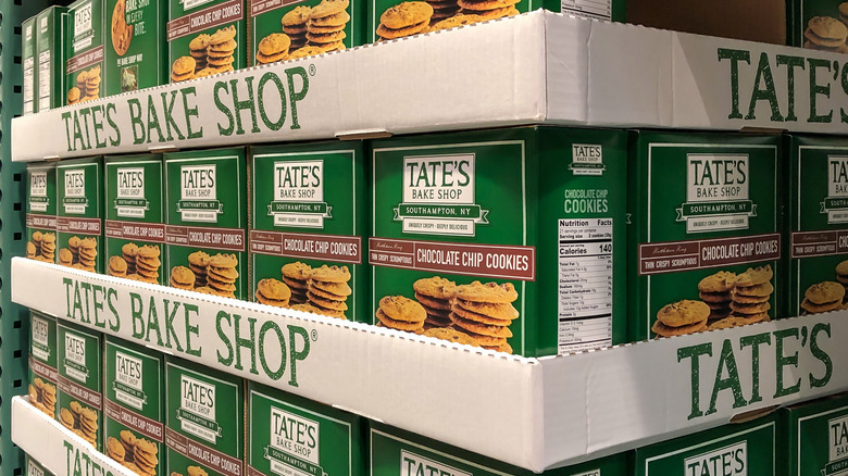 Boxes of Tate's Bake Shop cookies lined up neatly at a grocery store
