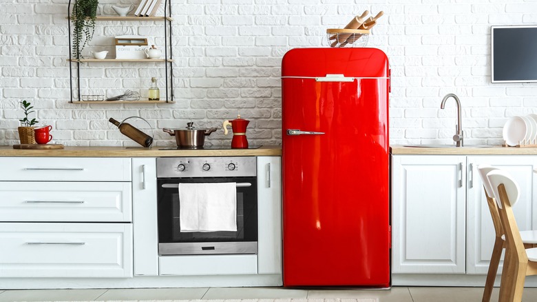 red refrigerator in kitchen
